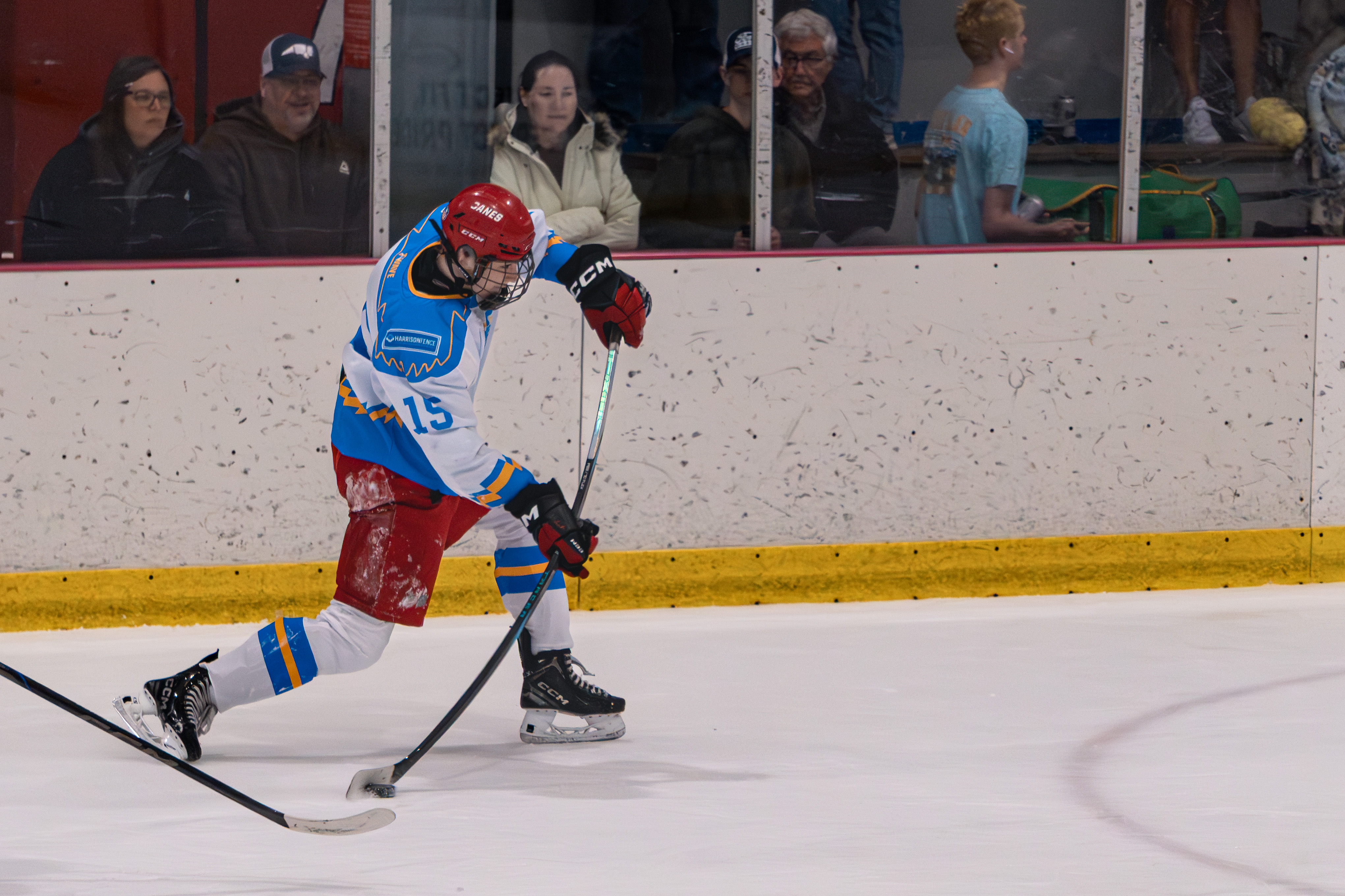 Hockey player loading a shot with visible stick flex in Wake Forest