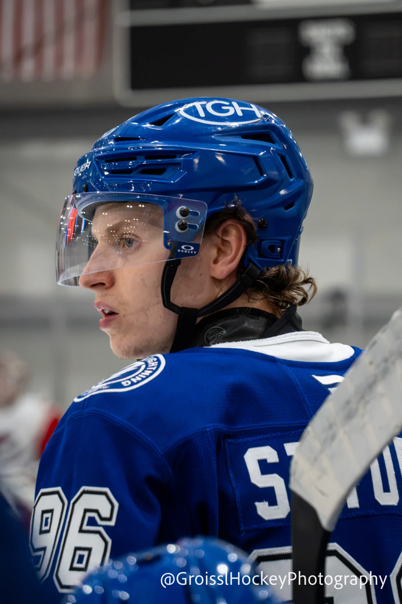 Tampa Bay Lightning skater looking back over his shoulder at rinkside