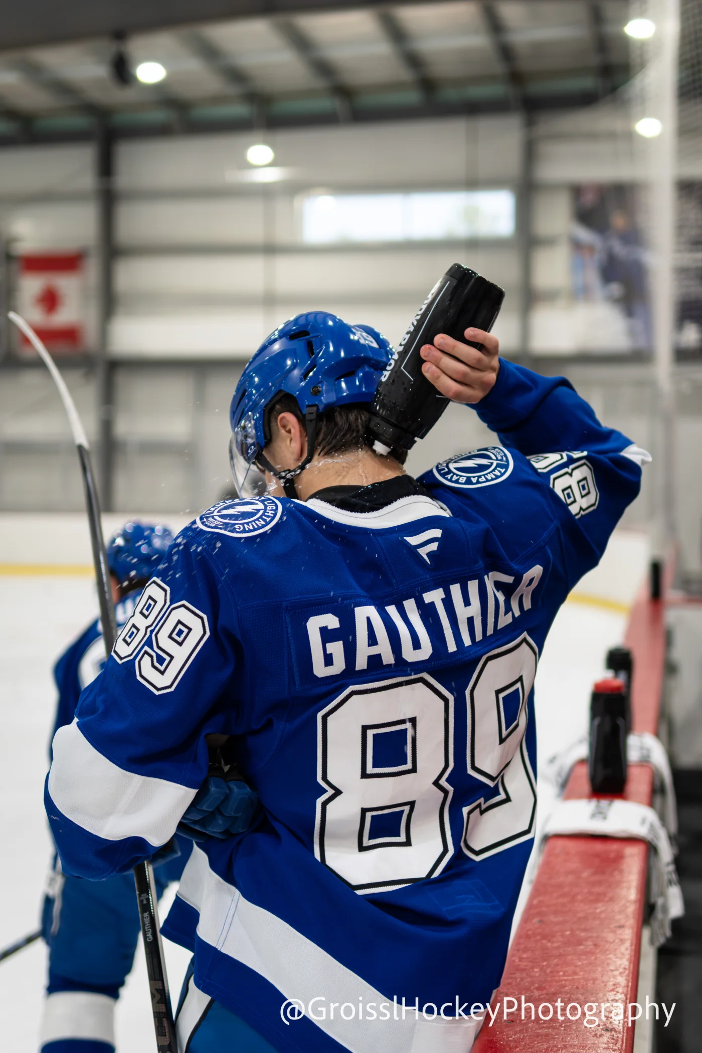 Ethan Gauthier taking water at the Tampa Bay Lightning bench