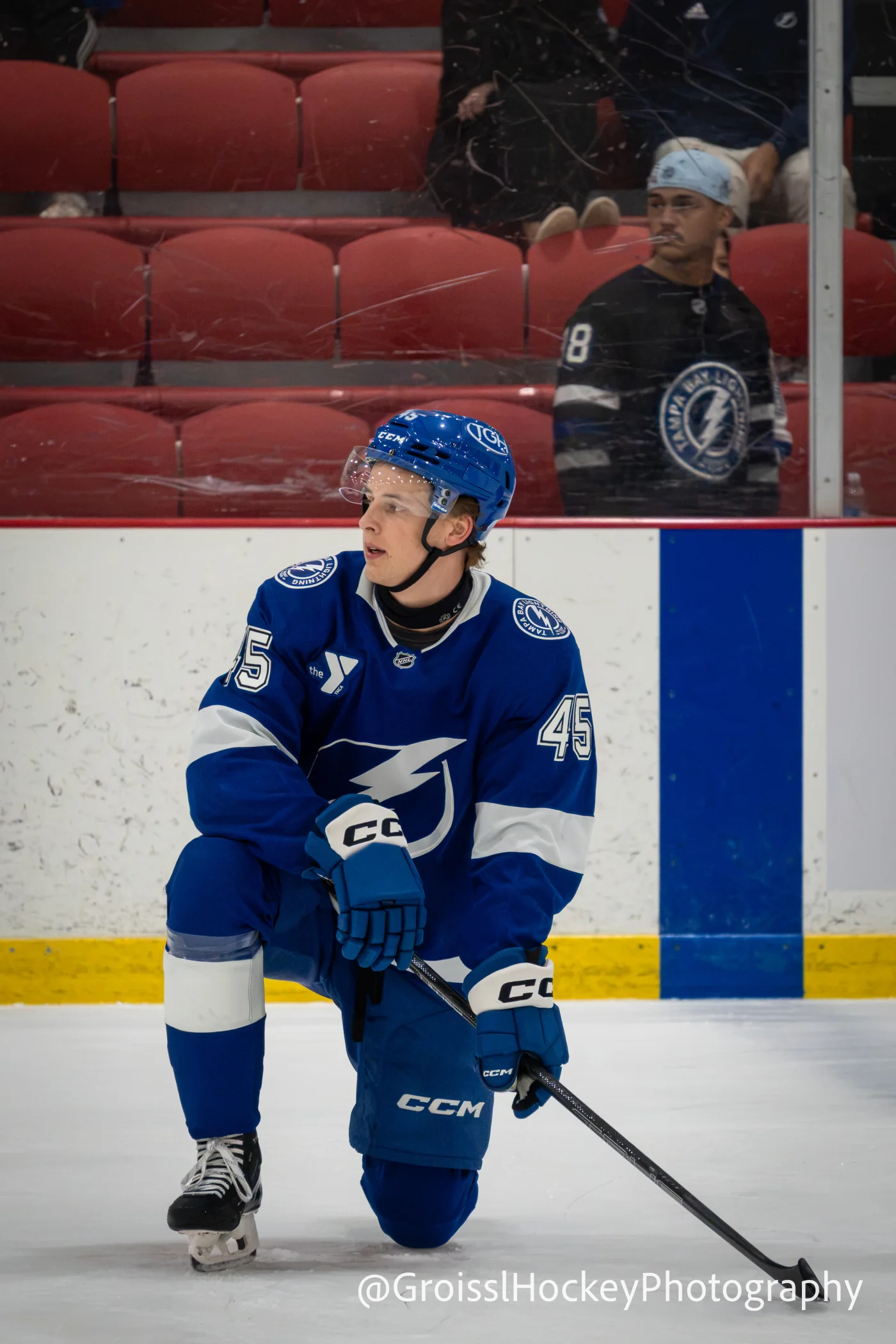 Tampa Bay Lightning prospect wearing number 45 kneeling on the ice